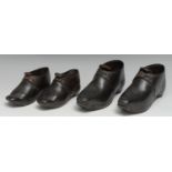 Costume - a graduating pair of early 19th century children's black leather shoes or boots, cold-