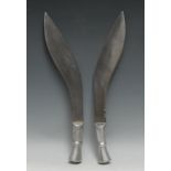 An Indian kukri, 34cm blade, alloy grip, 45.5cm long overall, mid-20th century; another, similar (2)