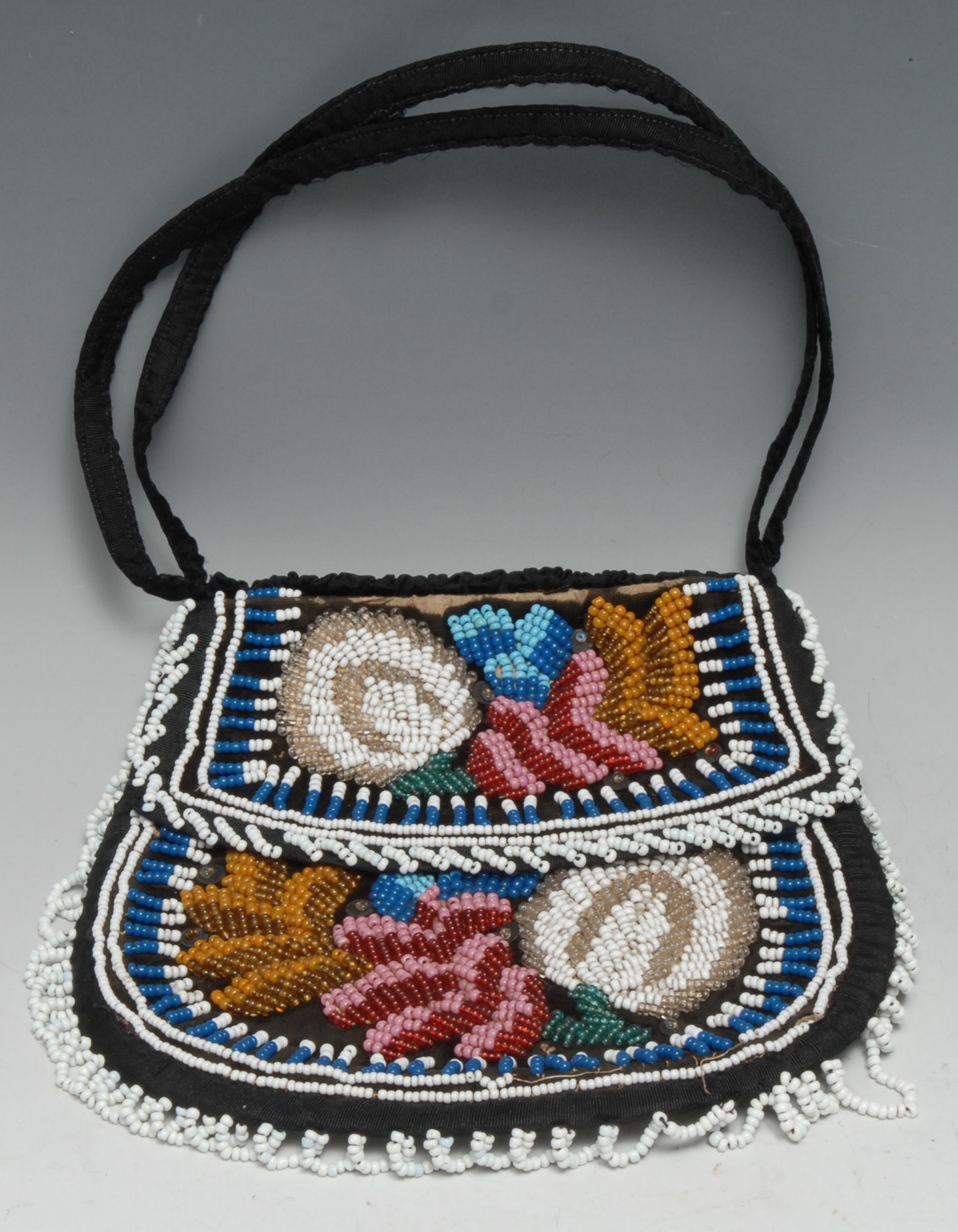 A Native American beadwork bag, typically brightly decorated, 17cm wide