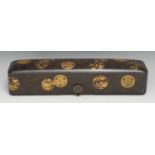 A Japanese laquer rectangular box and cover, decorated in gold makie with mon on a ground of