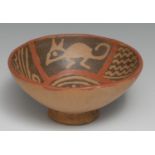 A South American terracotta circular bowl, decorated in the pre-Columbian manner with stylized