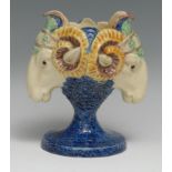 A 19th century Renaissance Revival majolica vase, boldly modelled with twin ram masks, glazed in the