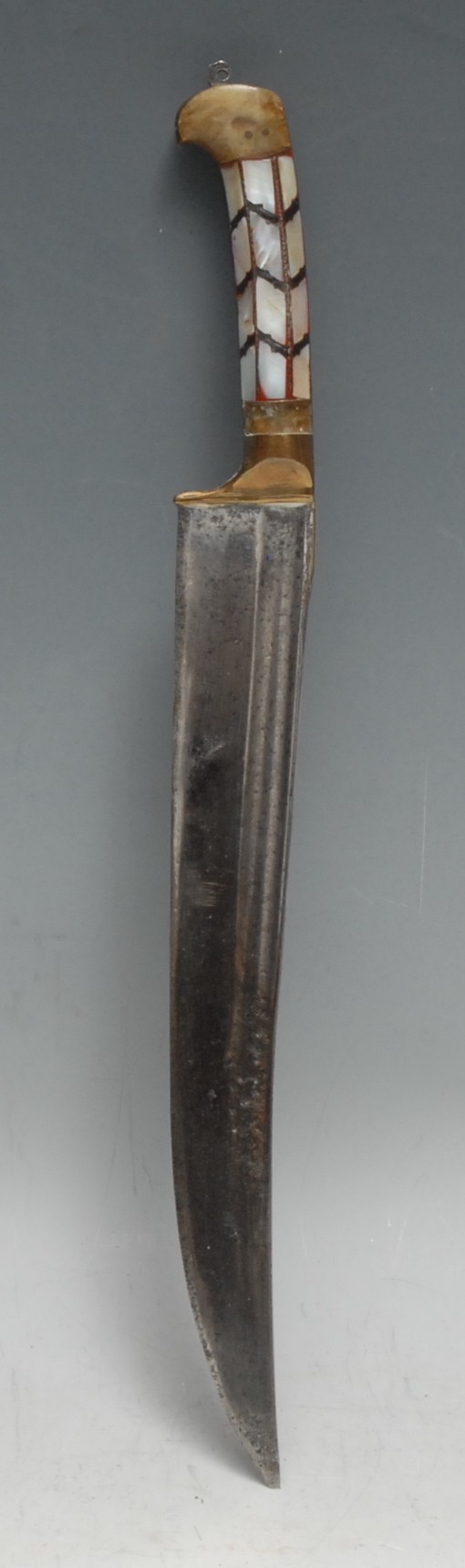 An Indian pesh kabz, 21.5cm slightly curved fullered blade, the two-piece grip with lozenges of horn