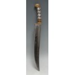 An Indian pesh kabz, 21.5cm slightly curved fullered blade, the two-piece grip with lozenges of horn
