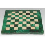 A malachite and marble chess board, outlined throughout with brass stringing, 20cm square