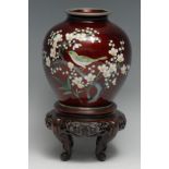 A Japanese cloisonné enamel ovoid vase, decorated in polychrome with a bird and a branch of