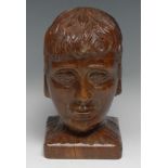 An oak folk art bust or newel post, carved as the head of a young man, 20cm high, 19th/early 20th