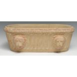 A Grand Tour style stone cistern or trough, carved after the Roman with lion masks, 46cm wide