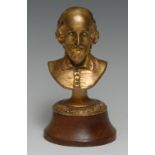 An early 20th century gilt metal library desk bust, of William Shakespeare, oak base, 16cm high