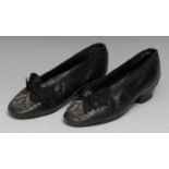 Costume - a pair of late George III children's black leather court shoes, the silk bows and toes