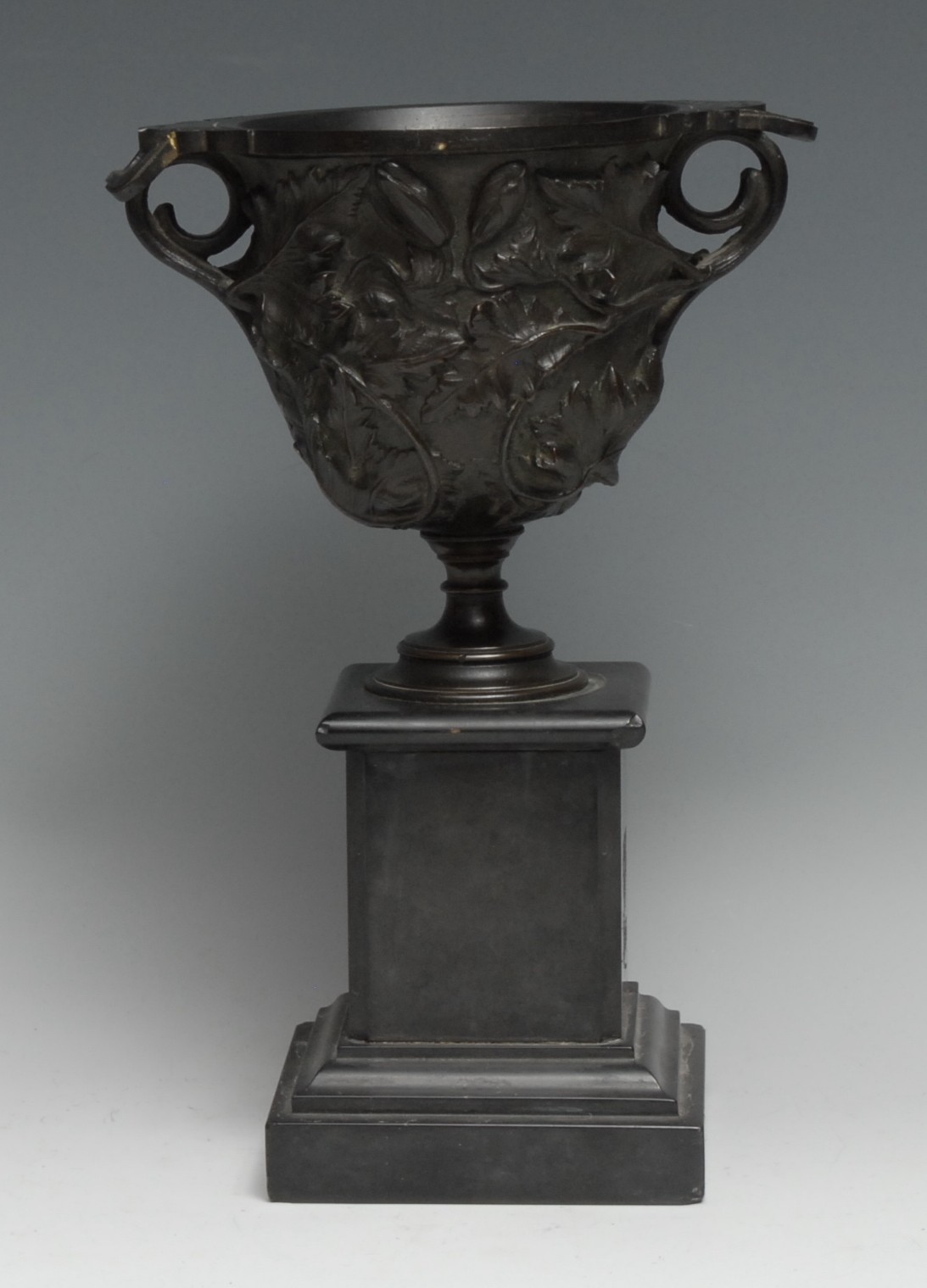 A 19th century Grand Tour dark patinated bronze vase, after an Antique krater, profusely cast with