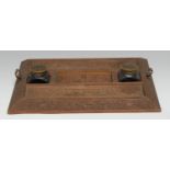 An Anglo-Indian hardwood desk stand, profusely carved with flowers and dense scrolling foliage,