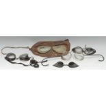 A pair of early 20th century motoring goggles, the circular lenses with mesh shield frames,
