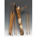 Tribal Art - an African hide quiver, containing seventeen arrows, various shapes and sizes of