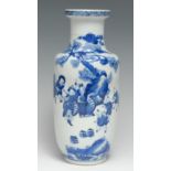A Chinese Rouleau vase, painted in tones of underglaze blue with an official and attendants, 24.