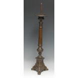 A North European pricket candlestick, compressed campana sconce above a fluted pillar, the triform