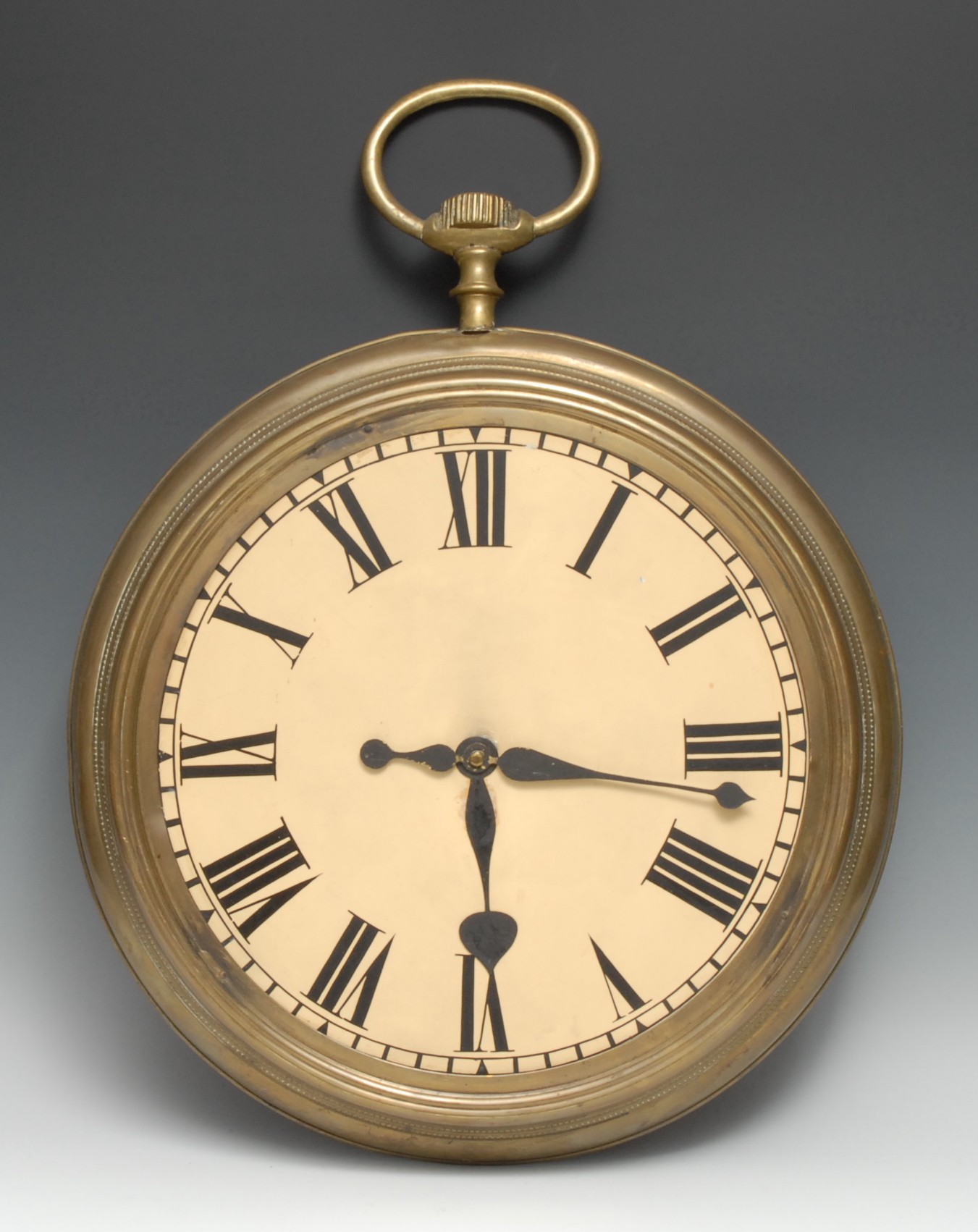 A novelty clock dial, probably an advertising shop display or sign, as an oversize pocket watch,