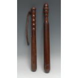 A 19th century mahogany truncheon, ring-turned handle, 41cm long, c.1880; another, rosewood (2)