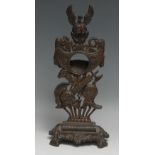 A substantial 19th century cast iron pocket watch stand, cast with triumphal regalia, 31.5cm high,