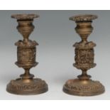 A pair of 19th century gilt bronze candlesticks, campana sconces with detachable nozzles, acanthus