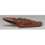 An Egyptian terracotta bathing rasp, as a crocodile, 20cm long
