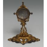 A 19th century gilt metal pocket watch stand, cast throughout with scrolls and strapwork, 13cm high,