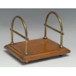 A late Victorian oak and brass desk top rack, by Samuel Hall & Sons of Birmingham, stamped, arched