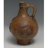 A 17th century Bellarmine brown salt-glazed stoneware jug, 21cm high, (restored and remodelled)