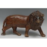 A rootwood carving, of a lion, 24cm long