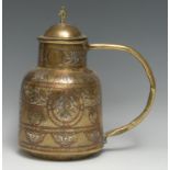 A Middle Eastern silver and copper damascened brass flagon, decorated and chased in the Islamic