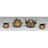 A Chinese bronze tripod censer and cover, cast in the Archaic manner with lappets and lion masks,