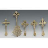 An Ethiopian Coptic brass cross, 30cm long, 19th century; others, similar (5)