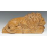 A Grand Tour type carved stone library model, of a lion, Canova, 52cm long