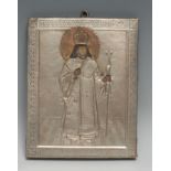 An Eastern Orthodox icon, depicting a Bishop, silvered riza, copper halo20.5cm x 16cm