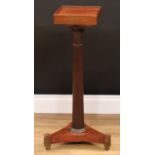 A Regency rosewood columnar pedestal, the fluted pillar with lotus capital, incurved tri-form