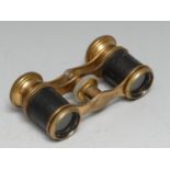 A pair of late 19th century French gilt brass opera glasses, mother of pearl focus adjustment, 9cm