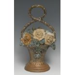 A 19th century brass door stop, cast as a basket of flowers, decorated in polychrome, 31.5cm high