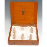 Antiquities - a collection of six Egyptian ushabtis and votives, the largest 6cm long, mahogany case