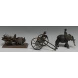 An Indian dark patinated bronze model, of a figure riding an elephant, 14cm long, probably Deccan,