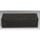 An Indian ebony scribe's qalamdan pen box, carved overall with lotus, flowers and dense scrolling