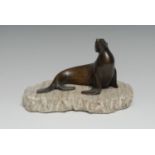 Continental School, a brown patinated bronze, of a seal, marble 'iceberg' base, 19cm wide