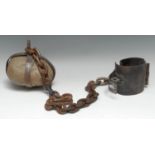 Penal History - a prisoner's ball and chain, the stone weight encased within iron straps, 118cm long