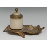 An early 20th century gilt metal and alabaster inkwell, cast with scrolling acanthus, hinged