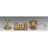 A George III brass rectangular inkstand, comprising two wells centred by a pounce pot, bracket feet,