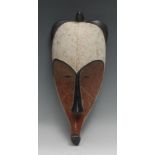 Tribal Art - a Fang Ngil mask, typically elongated concave stylised features, picked out with