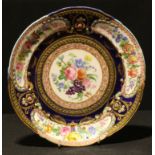 A Sevres plate, later decorated, 24cm diameter