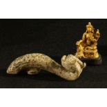 A Chinese hardstone belt hook, carved in the Archaic taste with a temple lion, 11cm long; a gilt