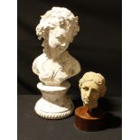 A classical antique style bust of a female, reconstituted stone, circular wooden base, 20cm; a