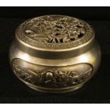 A Chinese silvered bronze censer and cover, pierced and cast with chrysanthemums, dragons and