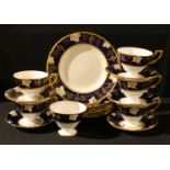 A Royal Crown Derby Vine Cobalt pattern tea set, six cups, five saucers, six tea plates, sandwich